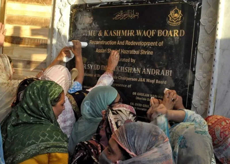 The plaque bearing the national emblem in the Hazratbal shrine of the Kashmir valley leads to massive protests